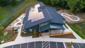aerial view of school with solar panels on roof